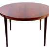 Elegant round wooden dining table with tapered legs, vintage Severin Hansen style in rich palisander.