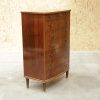 Vintage dark wood chest of drawers with eight drawers.
