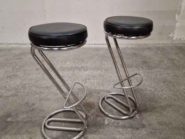 Sleek chrome and leather bar stools.