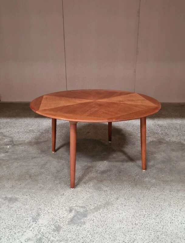 Round teak coffee table; mid-century modern geometric wood design.